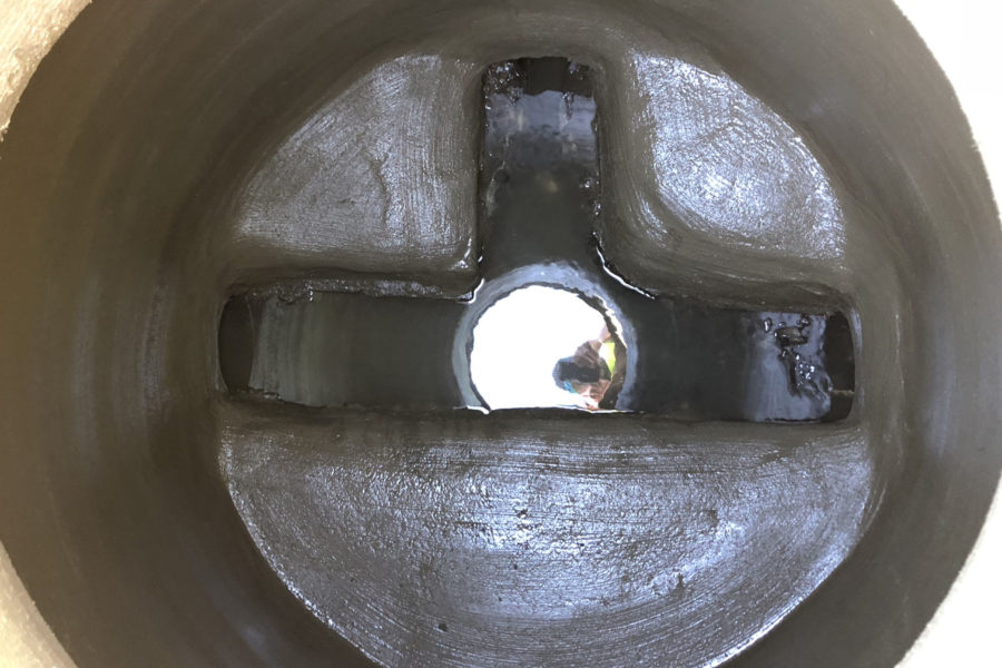 Completed SewperCoat® manhole rehabilitation with reconstructed bench and inverts in North Port, Charlotte County, Florida