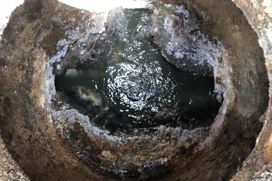 Deteriorated manhole interior in Charlotte County, Florida before SewperCoat® rehabilitation