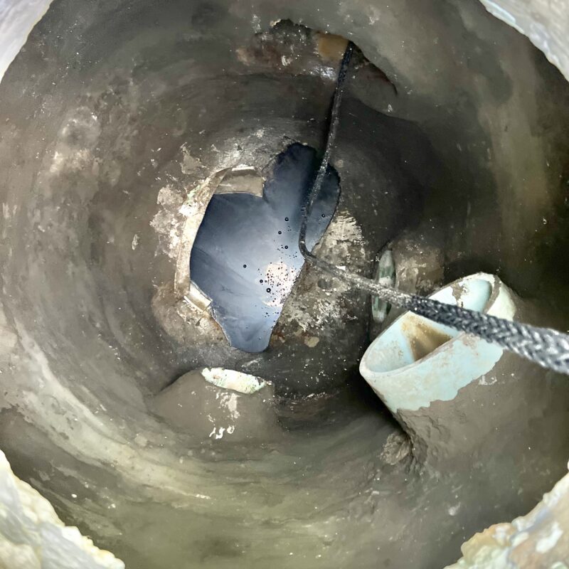 Manhole after surface preparation and leak sealing before SewperCoat application