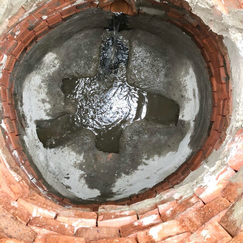 New manhole bench constructed and groundwater leaks sealed during rehabilitation