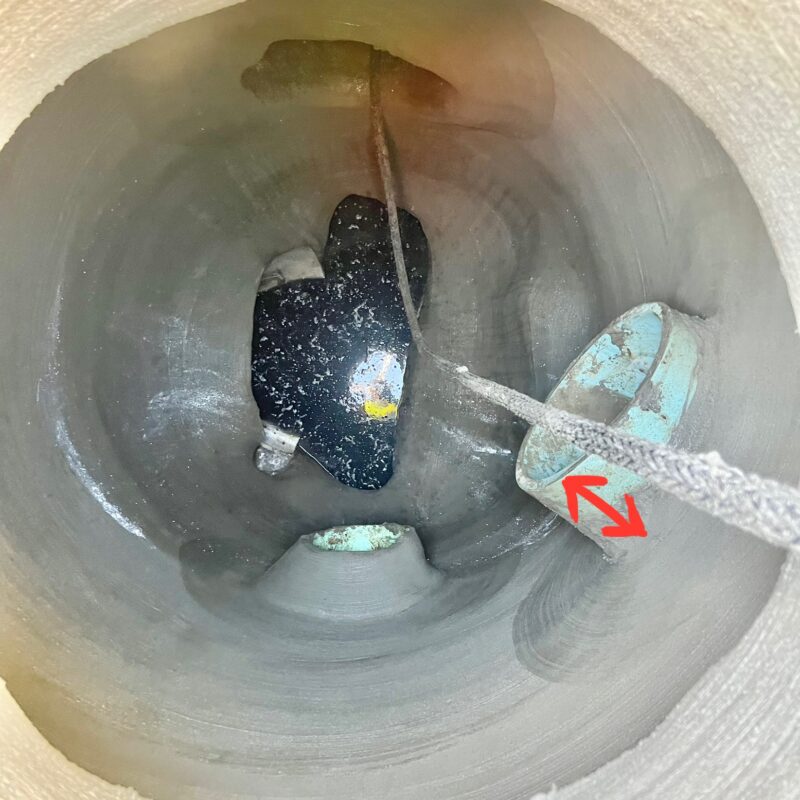 Manhole after SewperCoat rehabilitation with rebuilt substrate and reduced pipe exposure